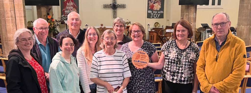 Members of the church council stand together to celebrate the eco award